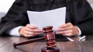 Close-up Of Judge In Front Of Mallet Holding Documents(Getty Images/iStockphoto) Close-up Of Judge In Front Of Mallet Holding Documents(Getty Images/iStockphoto)