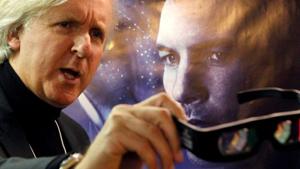 James Cameron shows 3D glasses as he poses in front of a poster before a promotion event for Avatar.(REUTERS) James Cameron shows 3D glasses as he poses in front of a poster before a promotion event for Avatar.(REUTERS)
