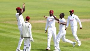 West Indies' Kemar Roach celebrates taking the wicket of England's Ben Stokes with Jason Holder and teammates, as play resumes behind closed doors following the outbreak of the coronavirus disease.(REUTERS) West Indies' Kemar Roach celebrates taking the wicket of England's Ben Stokes with Jason Holder and teammates, as play resumes behind closed doors following the outbreak of the coronavirus disease.(REUTERS)