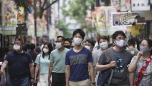 People wearing face masks to protect against the spread of the new coronavirus walk through Chinatown in Yokohama, near Tokyo, Friday, July 24, 2020.(AP) People wearing face masks to protect against the spread of the new coronavirus walk through Chinatown in Yokohama, near Tokyo, Friday, July 24, 2020.(AP)