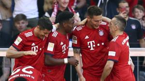 Bayern defender Niklas Suele, center right, celebrates with teammates(AP)