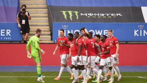 Soccer Football - Premier League - Leicester City v Manchester United - King Power Stadium, Leicester, Britain - July 26, 2020 Manchester United's Jesse Lingard celebrates scoring their second goal with teammates, as play resumes behind closed doors following the outbreak of the coronavirus disease (COVID-19) Pool via REUTERS/Oli Scarff(Pool via REUTERS) Soccer Football - Premier League - Leicester City v Manchester United - King Power Stadium, Leicester, Britain - July 26, 2020 Manchester United's Jesse Lingard celebrates scoring their second goal with teammates, as play resumes behind closed doors following the outbreak of the coronavirus disease (COVID-19) Pool via REUTERS/Oli Scarff(Pool via REUTERS)