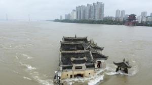 The Kwanyin temple built on a rocky island in the middle of the Yangtze River is seen flooded as the water level surge along Ezhou in central China's Hubei province on Sunday, July 19, 2020.(AP) The Kwanyin temple built on a rocky island in the middle of the Yangtze River is seen flooded as the water level surge along Ezhou in central China's Hubei province on Sunday, July 19, 2020.(AP)