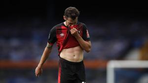 Bournemouth's Adam Smith walks off the field after their English Premier League soccer match between Everton and Bournemouth at Goodison Park in Liverpool.(AP)