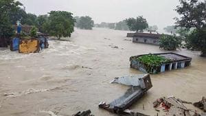 Houses are seen submerged in flood waters following heavy rain, in Gopalganj district of Bihar on Monday.(PTI Photo)