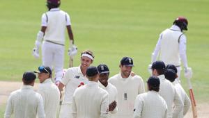 England's Stuart Broad (4L) celebrates with England's James Anderson (C) after taking the wicket of West Indies' Kraigg Brathwaite, his 500th Test wicket, on the final day of the third Test cricket match between England and the West Indies at Old Trafford in Manchester(AFP) England's Stuart Broad (4L) celebrates with England's James Anderson (C) after taking the wicket of West Indies' Kraigg Brathwaite, his 500th Test wicket, on the final day of the third Test cricket match between England and the West Indies at Old Trafford in Manchester(AFP)