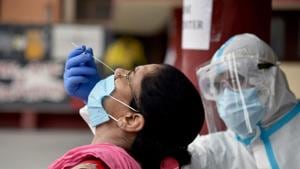 A health worker collects a nasal sample from a woman for a Covid-19 test at a health center in New Delhi on Wednesday.(ANI) A health worker collects a nasal sample from a woman for a Covid-19 test at a health center in New Delhi on Wednesday.(ANI)