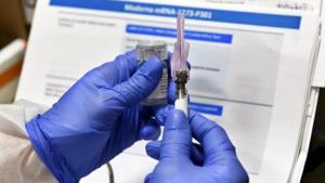Nurse prepares a shot as the world's biggest study of a possible Covid-19 vaccine developed by the National Institutes of Health and Moderna Inc. gets underway on July 27, 2020 in Binghamton, NY.(AP File Photo) Nurse prepares a shot as the world's biggest study of a possible Covid-19 vaccine developed by the National Institutes of Health and Moderna Inc. gets underway on July 27, 2020 in Binghamton, NY.(AP File Photo)