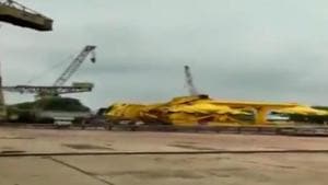 The crane came crashing down in a matter of few seconds crushing several people.(ANI Photo) The crane came crashing down in a matter of few seconds crushing several people.(ANI Photo)