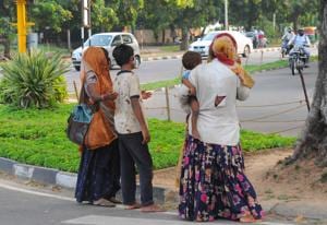 Women and children begging at the light point at Sector 22 in Chandigarh.(HT Photo) Women and children begging at the light point at Sector 22 in Chandigarh.(HT Photo)
