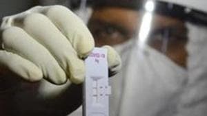 A doctor shows the Covid 19 rapid test kit at Naidu Hospital in Pune on Wednesday.(Shankar Narayan/HT Photo)