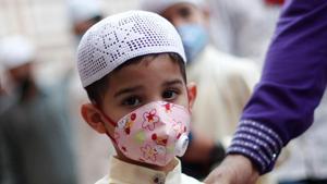A Muslim boy wearing face mask leaves the Jama Masjid (Grand Mosque) after Eid al-Adha prayers during the outbreak of the coronavirus disease (COVID-19), in the old quarters of Delhi.(REUTERS) A Muslim boy wearing face mask leaves the Jama Masjid (Grand Mosque) after Eid al-Adha prayers during the outbreak of the coronavirus disease (COVID-19), in the old quarters of Delhi.(REUTERS)
