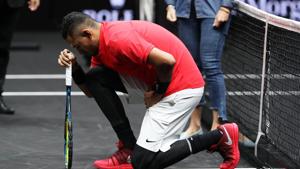 Nick Kyrgios of Team World joined NFL stars from Wembley by dropping his knee before his Laver Cup match with Roger Federer today during his mens singles match against Roger Federer of Team Europe on the final day of the Laver cup on September 24, 2017 in Prague, Czech Republic.(Getty Images) Nick Kyrgios of Team World joined NFL stars from Wembley by dropping his knee before his Laver Cup match with Roger Federer today during his mens singles match against Roger Federer of Team Europe on the final day of the Laver cup on September 24, 2017 in Prague, Czech Republic.(Getty Images)