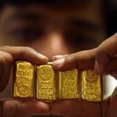 A salesman displays gold bars inside a jewellery shop in Hyderabad in this file photo. Gold is down more than Rs 4,300 per 10 gram after hitting a high of about Rs 56,200 per 10 gram August 7.(Reuters Photo) A salesman displays gold bars inside a jewellery shop in Hyderabad in this file photo. Gold is down more than Rs 4,300 per 10 gram after hitting a high of about Rs 56,200 per 10 gram August 7.(Reuters Photo)