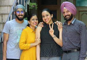 Darpan Ahluwalia, who ranked 80th in the country and second in the tricity, celebrating her success with her family in Mohali on Tuesday.(Gurminder Singh/HT) Darpan Ahluwalia, who ranked 80th in the country and second in the tricity, celebrating her success with her family in Mohali on Tuesday.(Gurminder Singh/HT)