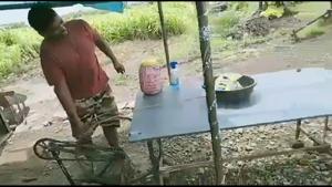 The man is seen moving the pedal which in turn moves a bowl across a long platform.(Twitter/@BharatP44) The man is seen moving the pedal which in turn moves a bowl across a long platform.(Twitter/@BharatP44)