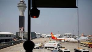 A Hainan Airlines aircraft is seen at the Beijing Capital International Airport following the global coronavirus disease (Covid-19) outbreak, in Beijing, China.(REUTERS) A Hainan Airlines aircraft is seen at the Beijing Capital International Airport following the global coronavirus disease (Covid-19) outbreak, in Beijing, China.(REUTERS)