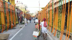 Streets decorated with flowers on the eve of the groundbreaking ceremony of the Ram Mandir at Hanumangarhi area in Ayodhya on Tuesday.(PTI Photo) Streets decorated with flowers on the eve of the groundbreaking ceremony of the Ram Mandir at Hanumangarhi area in Ayodhya on Tuesday.(PTI Photo)