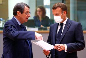 Cypriot President Nicos Anastasiades and France's President Emmanuel Macron speak during the first face-to-face EU summit since the coronavirus disease (Covid-19) outbreak, in Brussels, Belgium July 18, 2020.(Reuters photo) Cypriot President Nicos Anastasiades and France's President Emmanuel Macron speak during the first face-to-face EU summit since the coronavirus disease (Covid-19) outbreak, in Brussels, Belgium July 18, 2020.(Reuters photo)