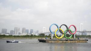A tugboat moves a symbol installed for the Olympic and Paralympic Games Tokyo 2020 on a barge moved away from its usual spot off the Odaiba Marine Park in Tokyo Thursday.(AP) A tugboat moves a symbol installed for the Olympic and Paralympic Games Tokyo 2020 on a barge moved away from its usual spot off the Odaiba Marine Park in Tokyo Thursday.(AP)