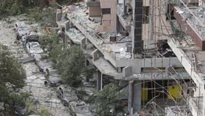People inspect the damage near the site of Tuesday's blast in Beirut's port area, Lebanon.(REUTERS) People inspect the damage near the site of Tuesday's blast in Beirut's port area, Lebanon.(REUTERS)