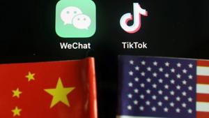 The messenger app WeChat and short-video app TikTok are seen near China and U.S. flags in this illustration picture taken August 7, 2020.(REUTERS) The messenger app WeChat and short-video app TikTok are seen near China and U.S. flags in this illustration picture taken August 7, 2020.(REUTERS)