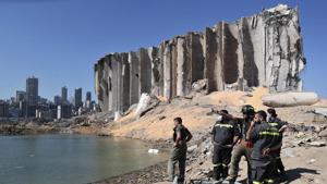 A rescue team surveys the site of this week's massive explosion in the port of Beirut, Lebanon.(AP) A rescue team surveys the site of this week's massive explosion in the port of Beirut, Lebanon.(AP)