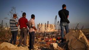 People view the damaged site of Tuesday's blast in Beirut's port area, Lebanon.(REUTERS) People view the damaged site of Tuesday's blast in Beirut's port area, Lebanon.(REUTERS)