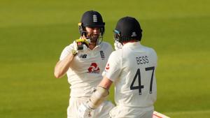 England's Chris Woakes celebrates winning the match with Dom Bess, as play resumes behind closed doors following the outbreak of the coronavirus disease(REUTERS) England's Chris Woakes celebrates winning the match with Dom Bess, as play resumes behind closed doors following the outbreak of the coronavirus disease(REUTERS)