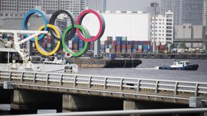 Tugboats move a symbol installed for the Olympic and Paralympic Games Tokyo 2020 on a barge from its usual spot off the Odaiba Marine Park in Tokyo(AP) Tugboats move a symbol installed for the Olympic and Paralympic Games Tokyo 2020 on a barge from its usual spot off the Odaiba Marine Park in Tokyo(AP)