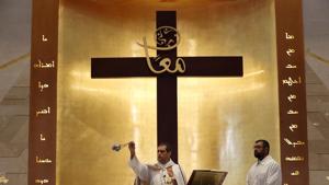 Lebanese priest Marwan Mouawad, center, celebrating during Sunday Mass at Saint Maron-Baouchrieh Church that was damaged by last Tuesday's explosion that hit the Beirut seaport, in Baouchrieh neighborhood in Beirut, Lebanon.(AP) Lebanese priest Marwan Mouawad, center, celebrating during Sunday Mass at Saint Maron-Baouchrieh Church that was damaged by last Tuesday's explosion that hit the Beirut seaport, in Baouchrieh neighborhood in Beirut, Lebanon.(AP)