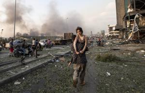 People evacuate wounded after of a massive explosion in Beirut, Lebanon, Tuesday, Aug. 4, 2020.(PTI photo) People evacuate wounded after of a massive explosion in Beirut, Lebanon, Tuesday, Aug. 4, 2020.(PTI photo)