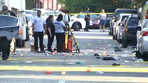 In this image from video provided by NBC4 Washington, law enforcement work the scene of a shooting, Sunday, August 9, 2020, in Southeast Washington.(AP) In this image from video provided by NBC4 Washington, law enforcement work the scene of a shooting, Sunday, August 9, 2020, in Southeast Washington.(AP)