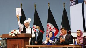 Afghan President Ashraf Ghani holds up the resolution on the last day of an Afghan Loya Jirga or traditional council, in Kabul.(AP file photo)