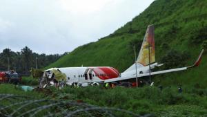 Officials inspect the site where a passenger plane crashed when it overshot the runway at the Calicut International Airport in Karipur, in the southern state of Kerala.(REUTERS) Officials inspect the site where a passenger plane crashed when it overshot the runway at the Calicut International Airport in Karipur, in the southern state of Kerala.(REUTERS)