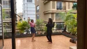 Renee and Alisah dance in rain. Renee and Alisah dance in rain.
