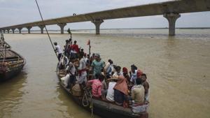 Villagers travel through the swollen Ganga, Patna, August. 6, 2020(PTI) Villagers travel through the swollen Ganga, Patna, August. 6, 2020(PTI)