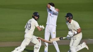 Pakistan's Shaheen Afridi, center, reacts as England's Chris Woakes, left, and Stuart Broad, right, run.(AP) Pakistan's Shaheen Afridi, center, reacts as England's Chris Woakes, left, and Stuart Broad, right, run.(AP)