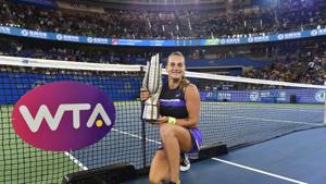 (FILES) This file photo taken on September 28, 2019 shows Aryna Sabalenka of Belarus posing with the trophy after her victory in the women's singles final match against Alison Riske of the US at the Wuhan Open tennis tournament in Wuhan. - The stuttering tennis season suffers a major blow as all top-level tournaments in China in 2020 are cancelled, including the WTA Finals, following a government edict against international sports to prevent a resurgence of the coronavirus. (Photo by HECTOR RETAMAL / AFP)(AFP) (FILES) This file photo taken on September 28, 2019 shows Aryna Sabalenka of Belarus posing with the trophy after her victory in the women's singles final match against Alison Riske of the US at the Wuhan Open tennis tournament in Wuhan. - The stuttering tennis season suffers a major blow as all top-level tournaments in China in 2020 are cancelled, including the WTA Finals, following a government edict against international sports to prevent a resurgence of the coronavirus. (Photo by HECTOR RETAMAL / AFP)(AFP)