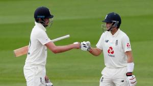 Cricket - First Test - England v Pakistan - Emirates Old Trafford, Manchester, Britain - August 8, 2020 England's Dom Sibley and Joe Root fist pump, as play resumes behind closed doors following the outbreak of the coronavirus disease (COVID-19) REUTERS/Lee Smith/Pool(REUTERS) Cricket - First Test - England v Pakistan - Emirates Old Trafford, Manchester, Britain - August 8, 2020 England's Dom Sibley and Joe Root fist pump, as play resumes behind closed doors following the outbreak of the coronavirus disease (COVID-19) REUTERS/Lee Smith/Pool(REUTERS)