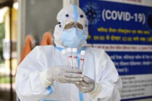 A health worker shows the collected swab sample for Reverse transcription-polymerase chain reaction (RT-PCR) for coronavirus test at the Ayushman Bharat Health and Wellness Centre in Gurugram. India’s Covid-19 tally went beyond 2.32 million after more than 60,000 cases of the coronavirus disease and over 834 deaths in the last 24 hours.(Parveen Kumar/HT Photo) A health worker shows the collected swab sample for Reverse transcription-polymerase chain reaction (RT-PCR) for coronavirus test at the Ayushman Bharat Health and Wellness Centre in Gurugram. India’s Covid-19 tally went beyond 2.32 million after more than 60,000 cases of the coronavirus disease and over 834 deaths in the last 24 hours.(Parveen Kumar/HT Photo)