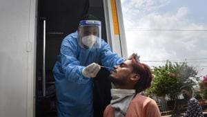 A health worker in PPE coveralls collects a swab sample from a person for coronavirus rapid antigen test, at Keshopur in New Delhi, on Wednesday.(Sanchit Khanna/HT Photo) A health worker in PPE coveralls collects a swab sample from a person for coronavirus rapid antigen test, at Keshopur in New Delhi, on Wednesday.(Sanchit Khanna/HT Photo)