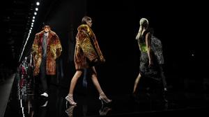 FILE - In this Friday, Feb. 21, 2020 file photo, models wear creations as part of Versace Fall/Winter 2020/2021 collection, presented in Milan, Italy. Giorgio Armani, Fendi, Prada and Versace are all returning to the runway in September, according to the Milan Fashion Week calendar published on Wednesday, Aug. 12, 2020.(AP Photo/Antonio Calanni, File) FILE - In this Friday, Feb. 21, 2020 file photo, models wear creations as part of Versace Fall/Winter 2020/2021 collection, presented in Milan, Italy. Giorgio Armani, Fendi, Prada and Versace are all returning to the runway in September, according to the Milan Fashion Week calendar published on Wednesday, Aug. 12, 2020.(AP Photo/Antonio Calanni, File)