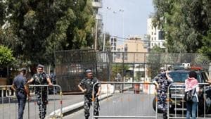 Members of Lebanese security forces block a road to stop protesters from reaching the UNESCO Palace where Lebanon's parliament is holding a session, in the aftermath of a massive explosion in Beirut's port area, in Beirut.(Reuters) Members of Lebanese security forces block a road to stop protesters from reaching the UNESCO Palace where Lebanon's parliament is holding a session, in the aftermath of a massive explosion in Beirut's port area, in Beirut.(Reuters)