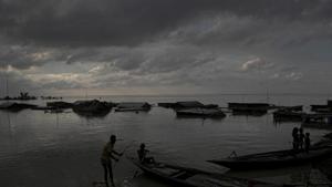 Flood affected people on boats are seen near their submerged houses in Morigaon district, Assam.(AP) Flood affected people on boats are seen near their submerged houses in Morigaon district, Assam.(AP)