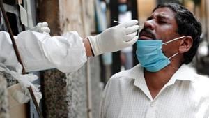 A health worker in personal protective equipment (PPE) collects a sample using a swab from a person at a local health centre to conduct tests for the coronavirus disease (COVID-19).(REUTERS) A health worker in personal protective equipment (PPE) collects a sample using a swab from a person at a local health centre to conduct tests for the coronavirus disease (COVID-19).(REUTERS)