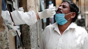 A health worker in personal protective equipment (PPE) collects a sample using a swab from a man at a local health centre to conduct tests for the coronavirus disease (Covid-19) in this file photo. Dr Uday Kakodkar, the nodal officer of Goa’s dedicated Covid-19 hospital, said the death rate of admitted patients, those with severe symptoms and comorbidities, stood at 5.77% while the overall fatality rate was less than 1%.(Reuters) A health worker in personal protective equipment (PPE) collects a sample using a swab from a man at a local health centre to conduct tests for the coronavirus disease (Covid-19) in this file photo. Dr Uday Kakodkar, the nodal officer of Goa’s dedicated Covid-19 hospital, said the death rate of admitted patients, those with severe symptoms and comorbidities, stood at 5.77% while the overall fatality rate was less than 1%.(Reuters)