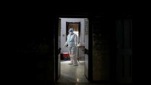 A health worker in personal protective equipment (PPE) waits at a local health centre for the next person to be tested for the coronavirus disease (COVID-19), amid the spread of the disease, in the old quarters of Delhi, India, August 14, 2020.(REUTERS) A health worker in personal protective equipment (PPE) waits at a local health centre for the next person to be tested for the coronavirus disease (COVID-19), amid the spread of the disease, in the old quarters of Delhi, India, August 14, 2020.(REUTERS)