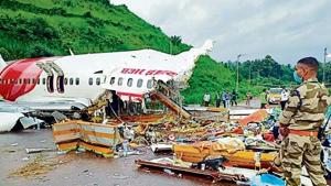 Officials inspect the wreckage of the Air India Express flight at the Kozhikode International Airport on August 8. Officials inspect the wreckage of the Air India Express flight at the Kozhikode International Airport on August 8.