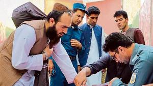 TIME TO GO: Policemen register Taliban prisoners as they are in the process of being released from the Pul-e-Charkhi prison on the outskirts of Kabul, Afghanistan. TIME TO GO: Policemen register Taliban prisoners as they are in the process of being released from the Pul-e-Charkhi prison on the outskirts of Kabul, Afghanistan.